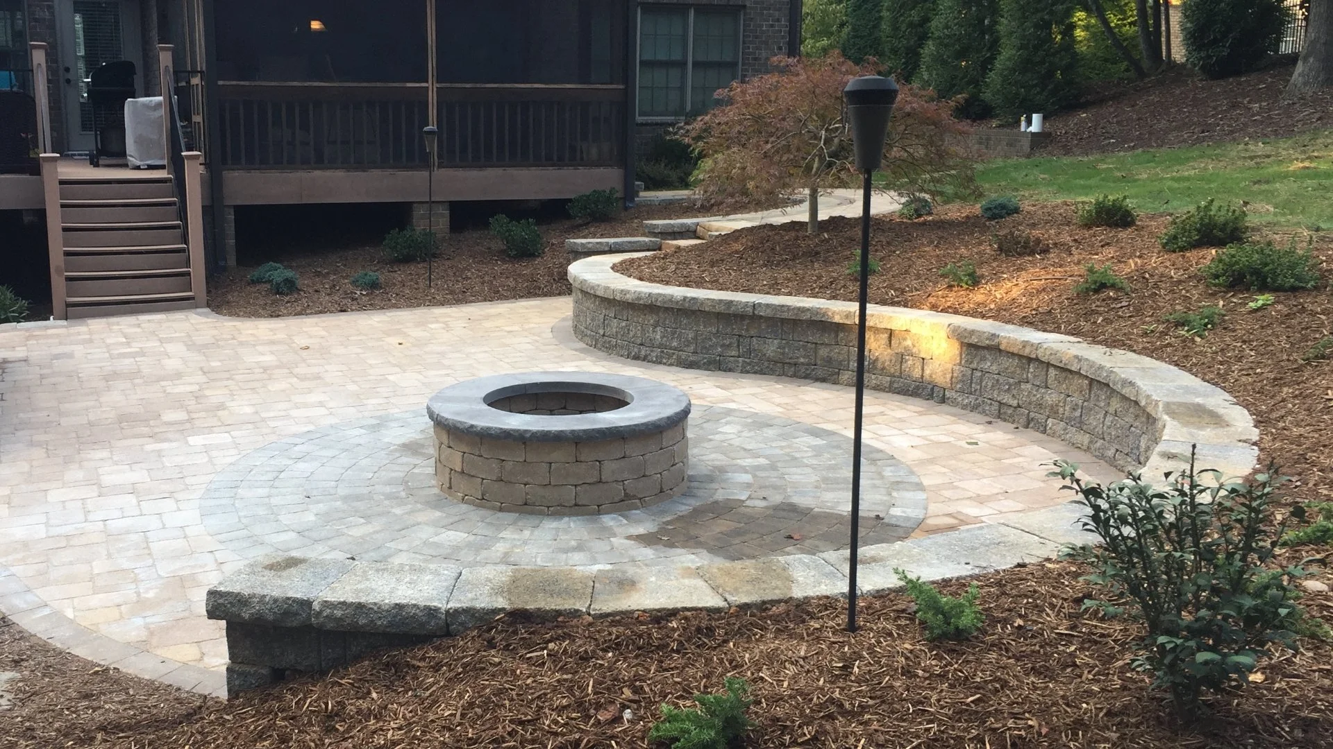 Want to Install a Patio on Your Sloped Yard? You Need a Retaining Wall!