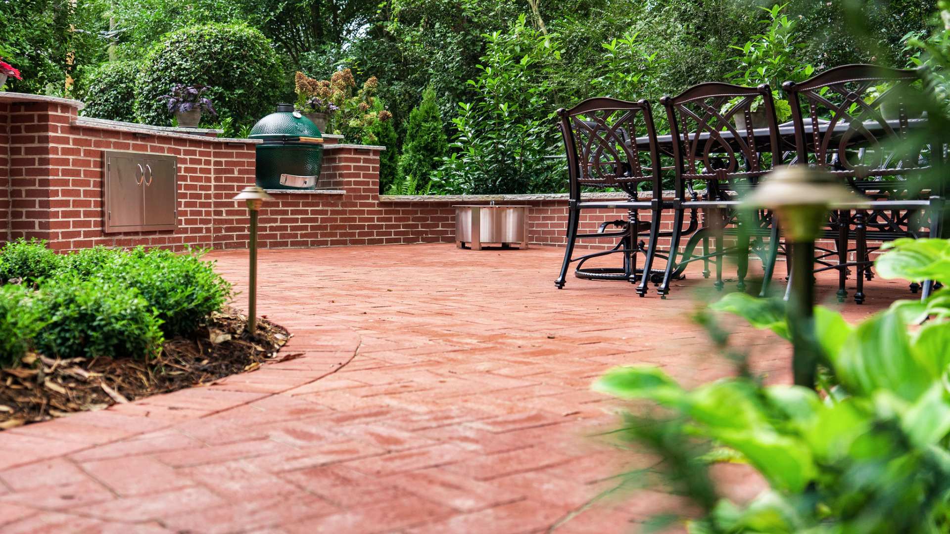 Custom built red brick patio and seating walls in Winston-Salem, NC.