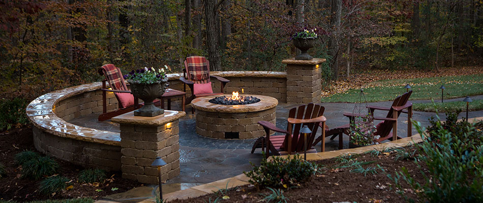 Custom fire pit and patio with seating wall near Summerfield, NC.