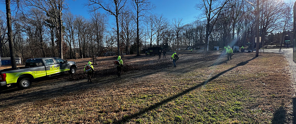 Ideal team's community involvement cleaning landscape in High Point, NC.