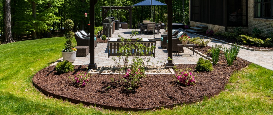 Mulch installed for planting bed in backyard in Bermuda Run, NC.
