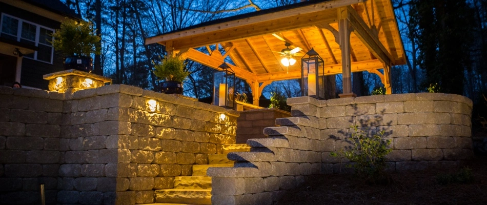 Outdoor lighting installed by stairs and retaining wall for patio in Bermuda Run, NC.