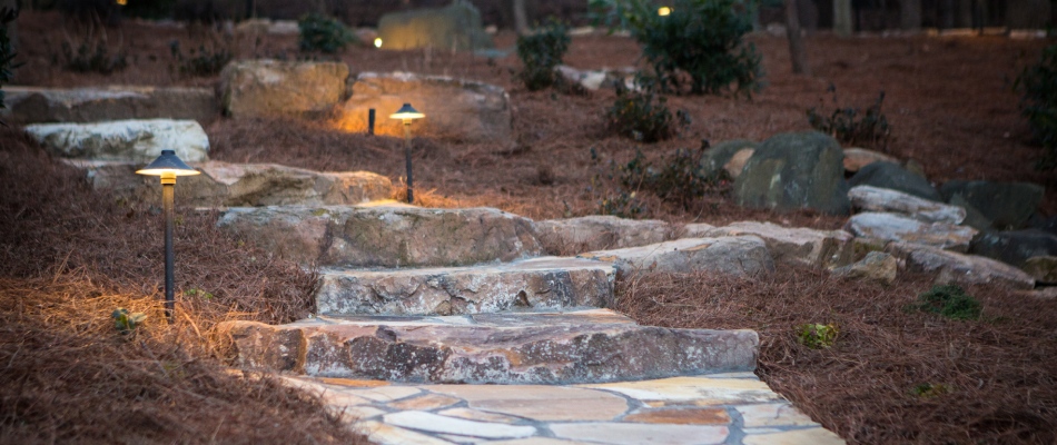 Custom stone outdoor steps with lighting installation in Greensboro, NC.