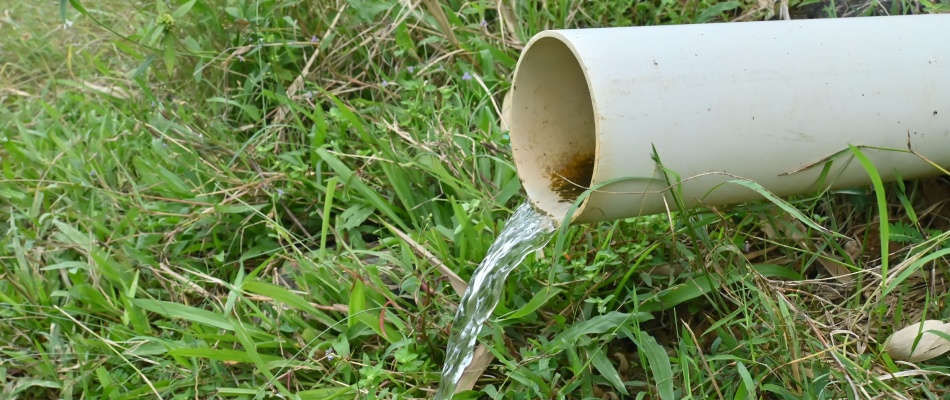 PVC pipe from drainage solution draining water in Winston-Salem, NC.