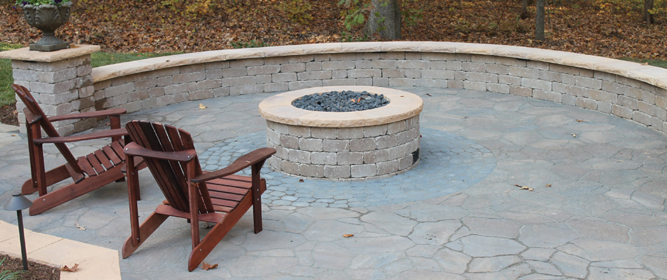 Seating wall installed by fire feature in Kernersville, NC.